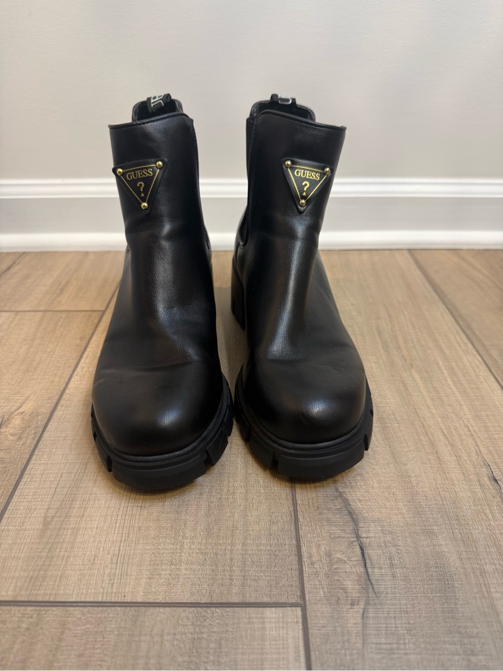 GUESS Black Leather Lug Sole Ankle Boots with Gold Logo Plaques